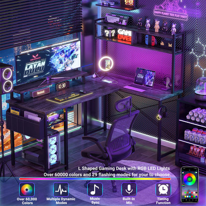 Besiost Small L Shaped Gaming Desk with Power Outlets, 48" Reversible L Shaped LED Computer Desk with Monitor Stand & Storage Shelf, Corner Gamer Desk Home Office Desk with Storage Bag, Black Oak